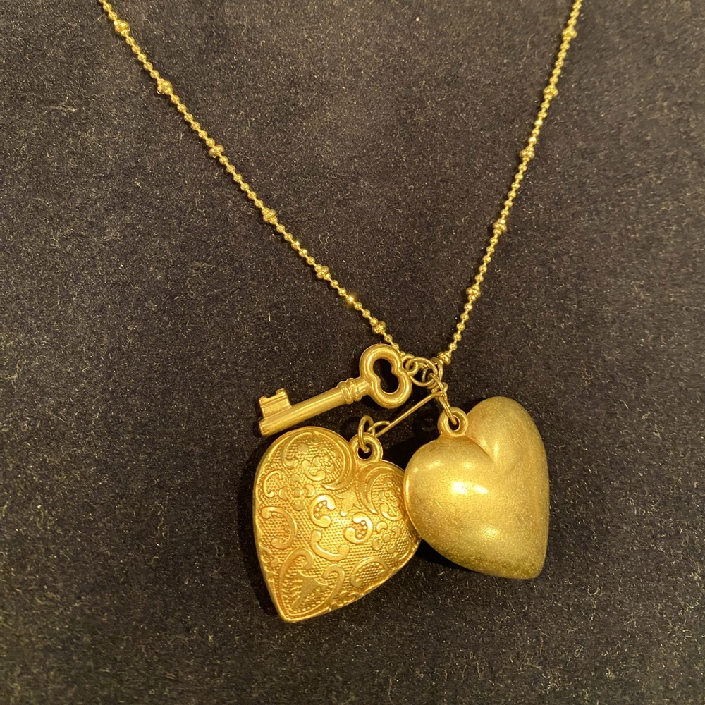 Heart and key 18 karat gold plated pendant necklace by Sheila Fajl.